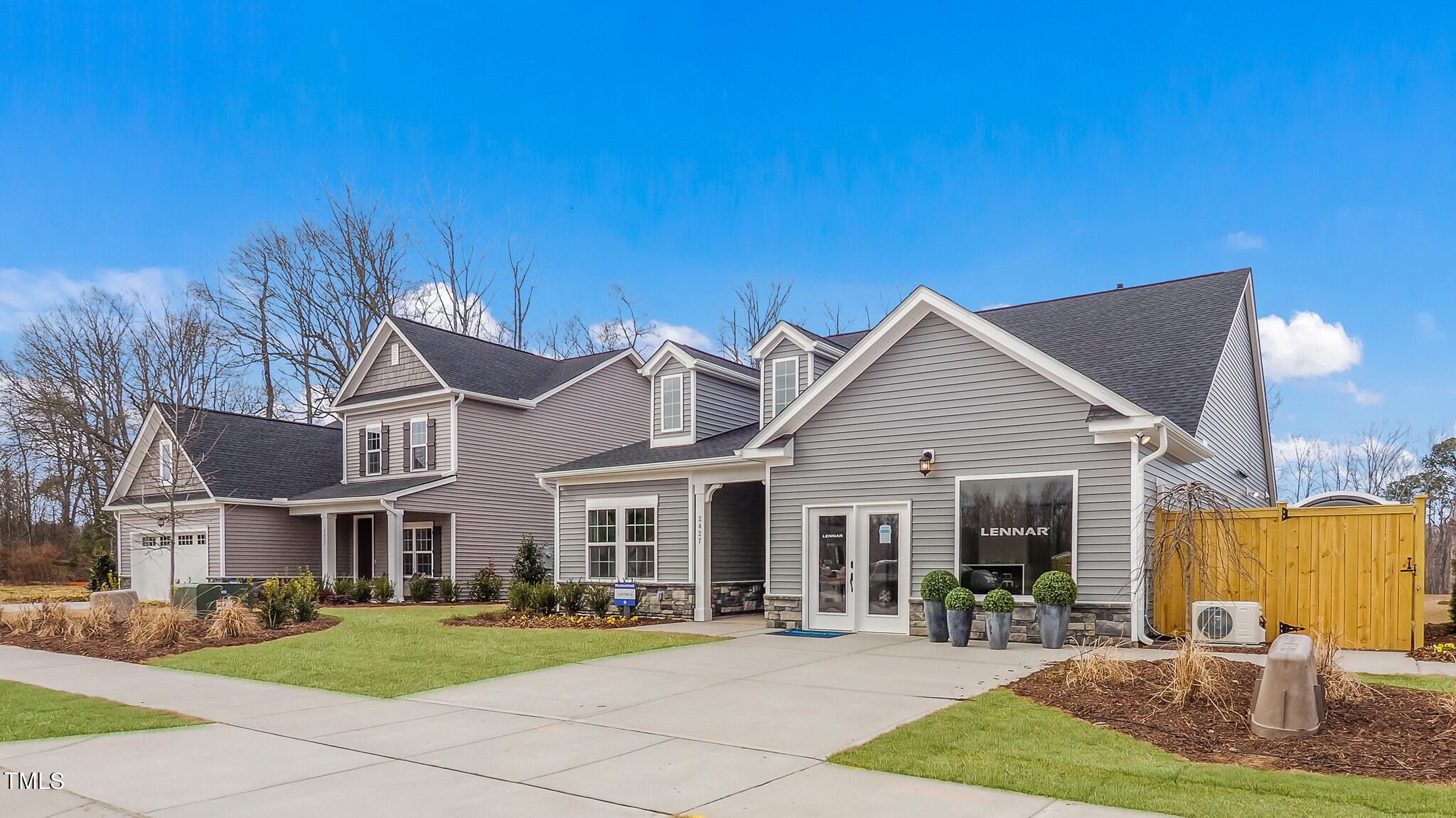 a front view of a house with garden and patio