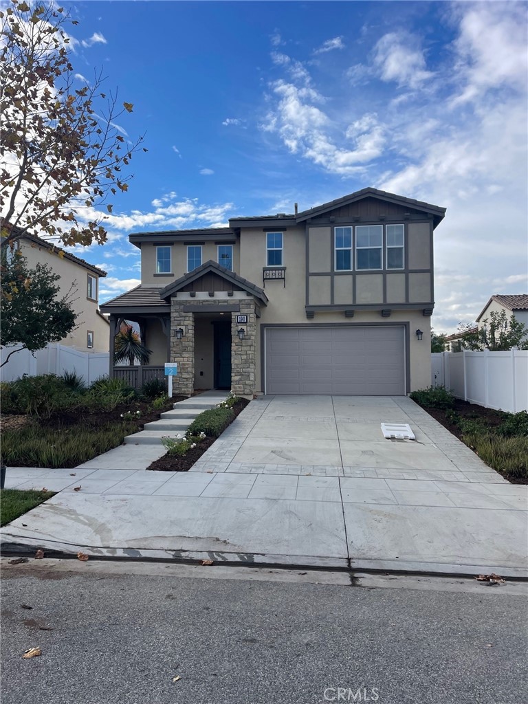 a front view of a house with garage