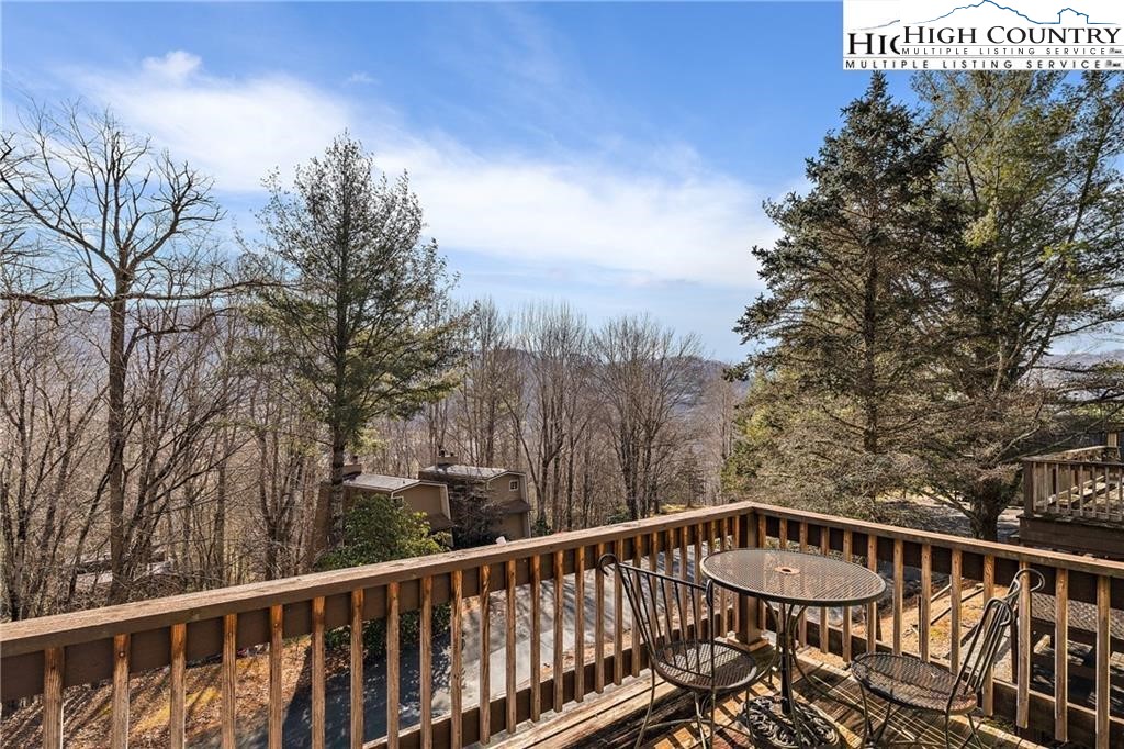 a view of a balcony with trees