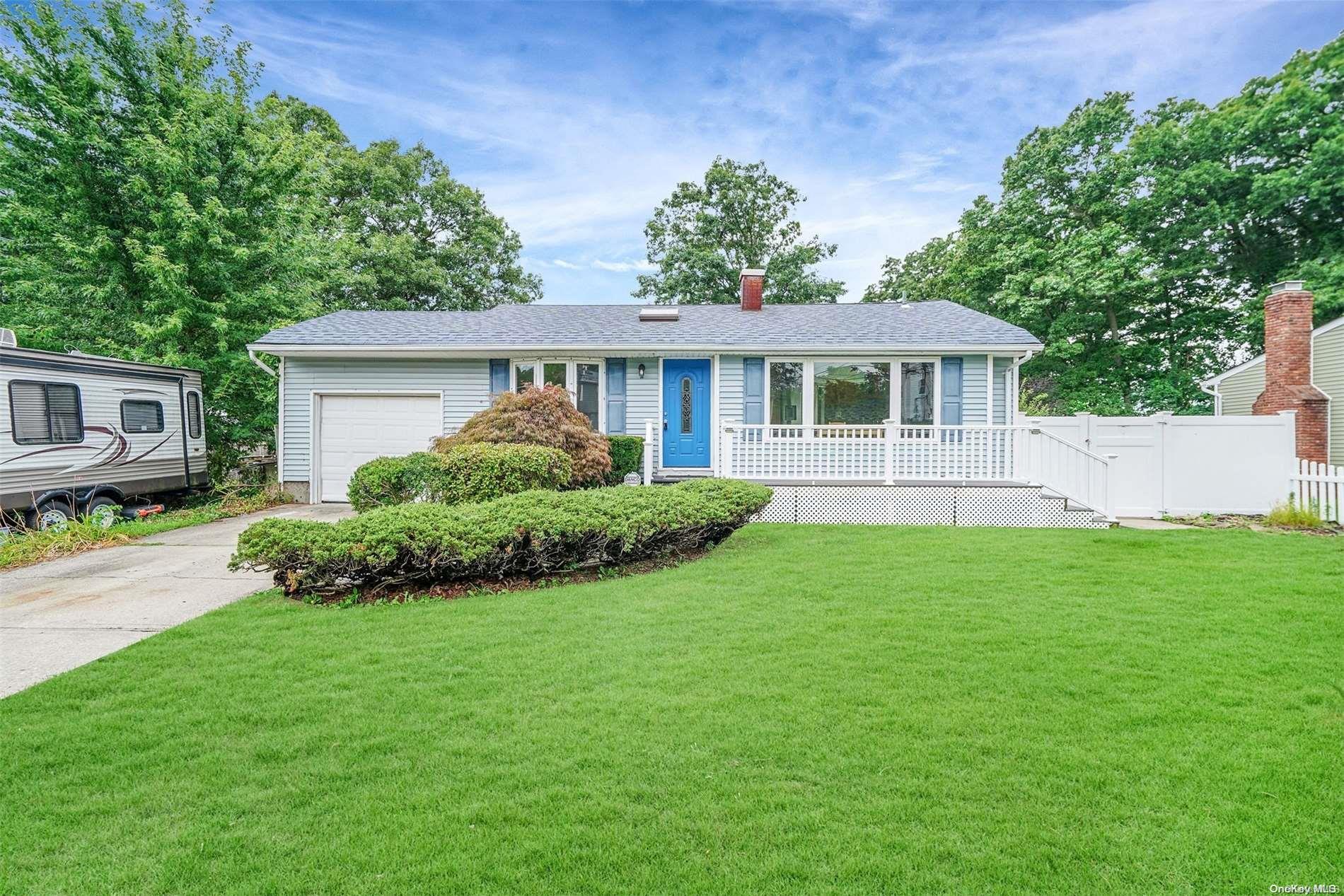 a view of house with yard and green space