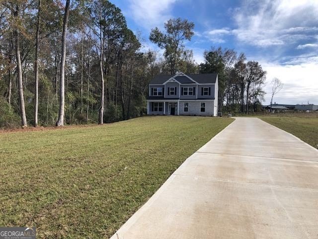 a front view of a house with a yard