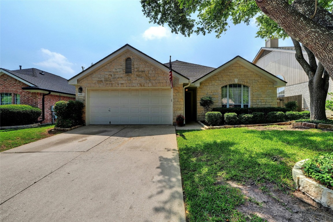 Gorgeous white stone with updated laminated architectural (3-D) roofline is the perfect home that will be protected from the Texas storms.