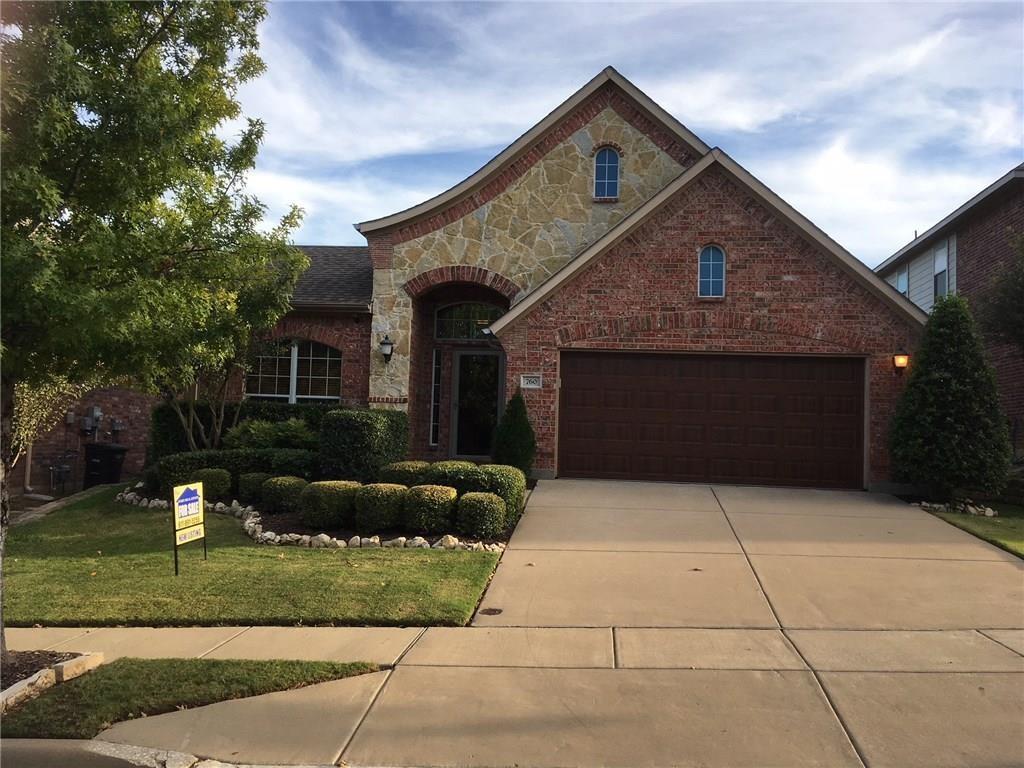 View of front facade with a front lawn and a garage