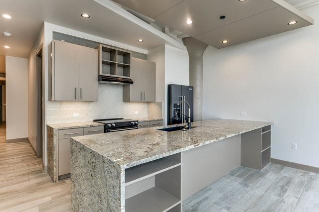 a kitchen with a stove and a sink