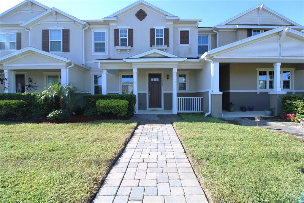 a front view of a house with garden