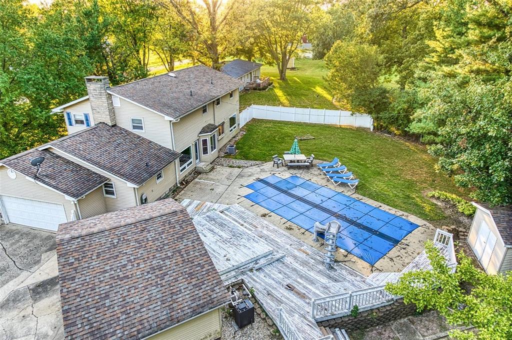 aerial view of a house with a yard