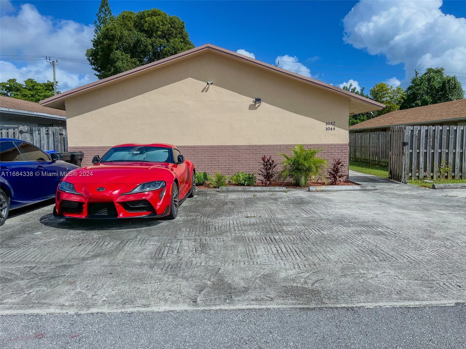 a car parked in front of a house