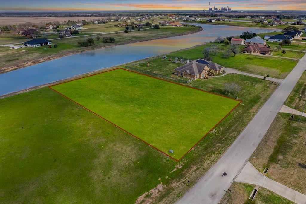 an aerial view of a houses with outdoor space and lake view