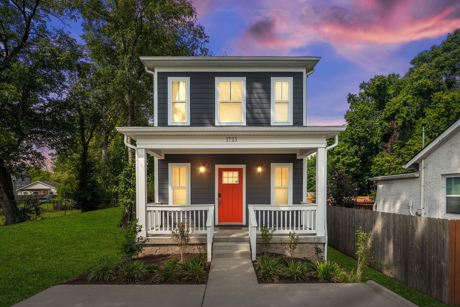 a front view of a house with a yard