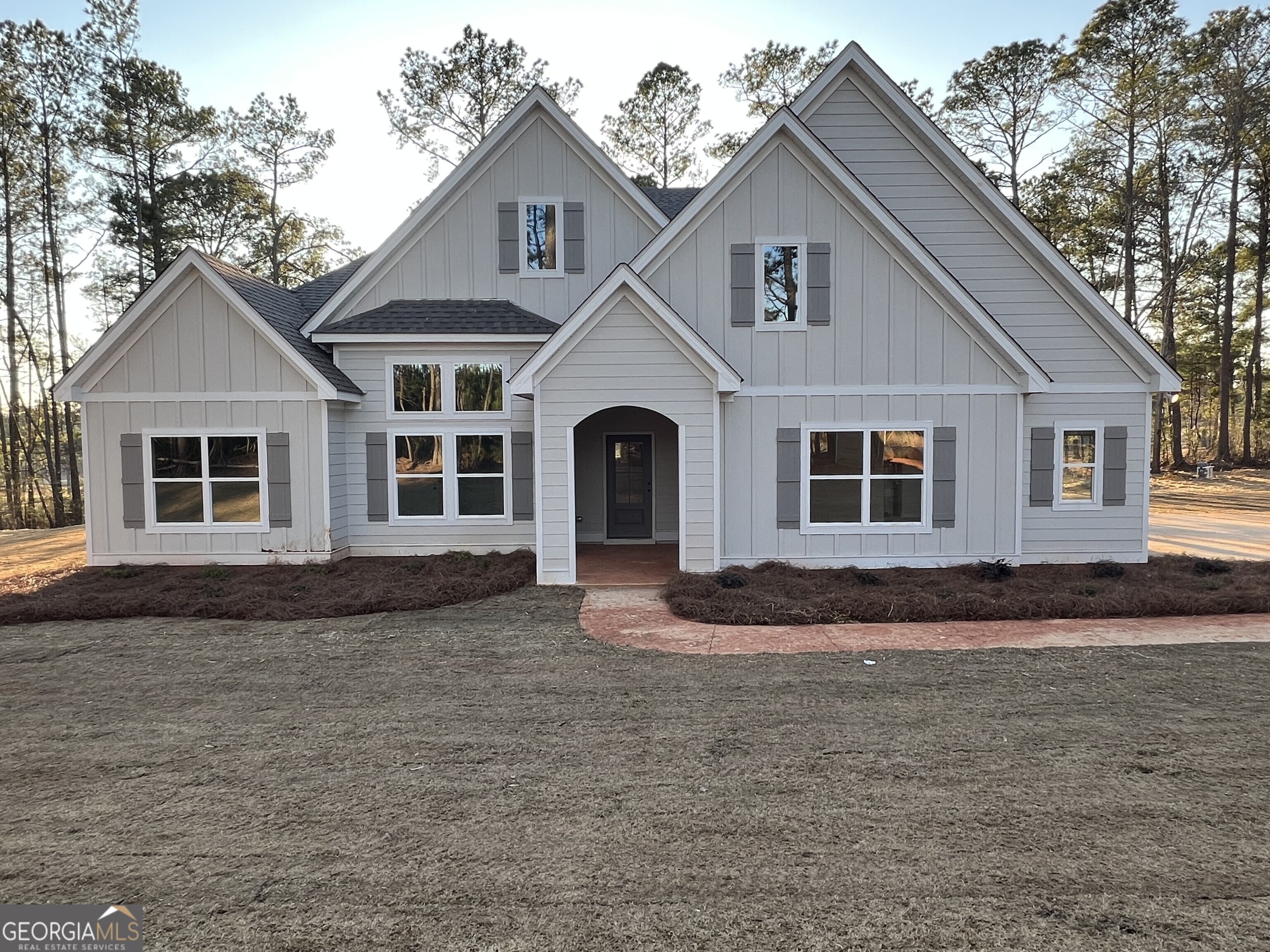 a front view of a house with a yard