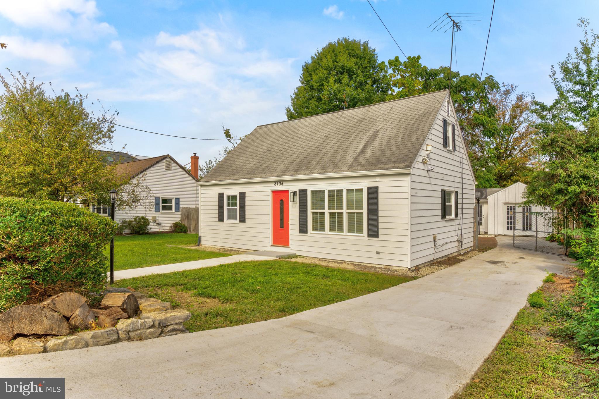 a aerial view of a house next to a yard