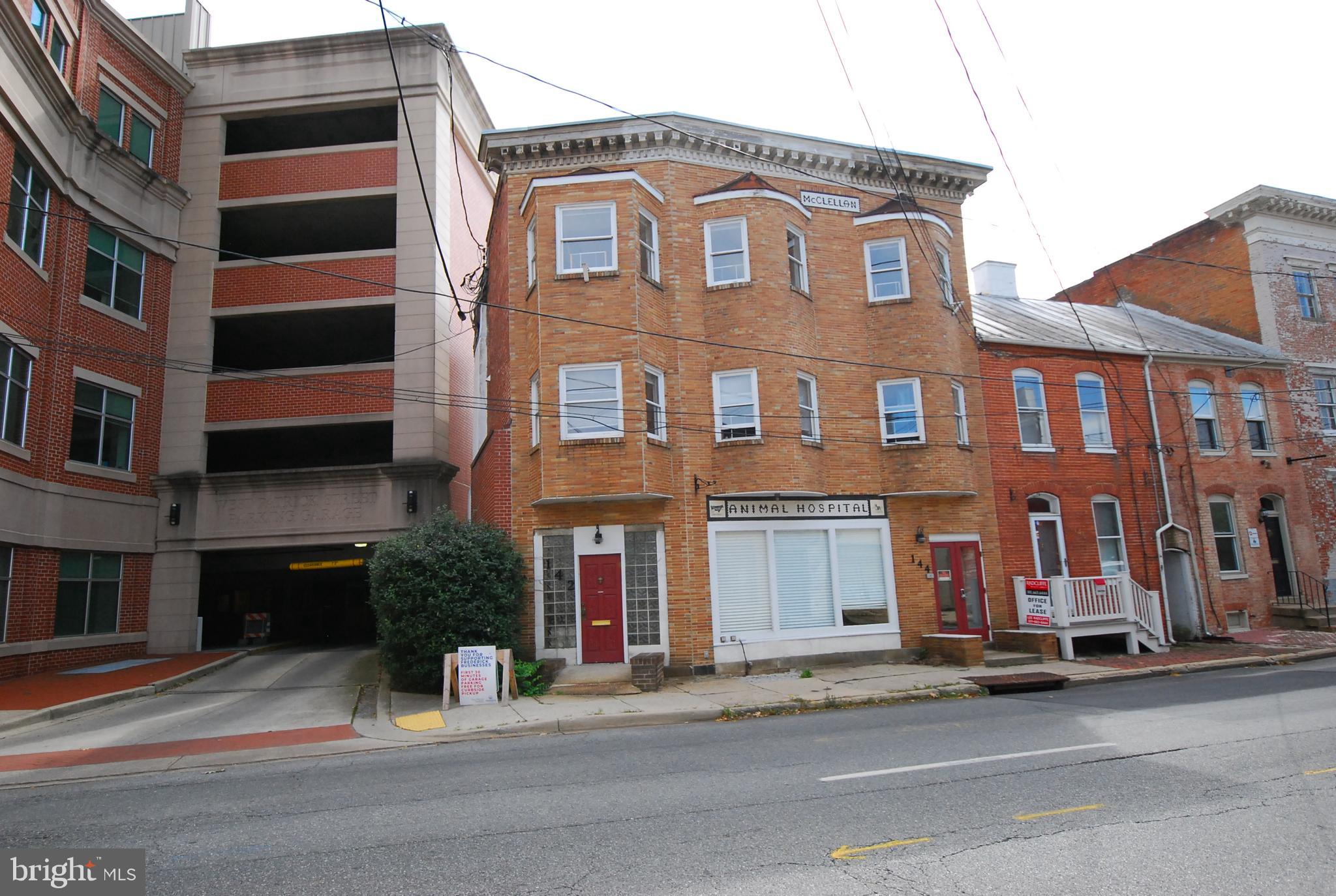 a view of a brick building with many windows