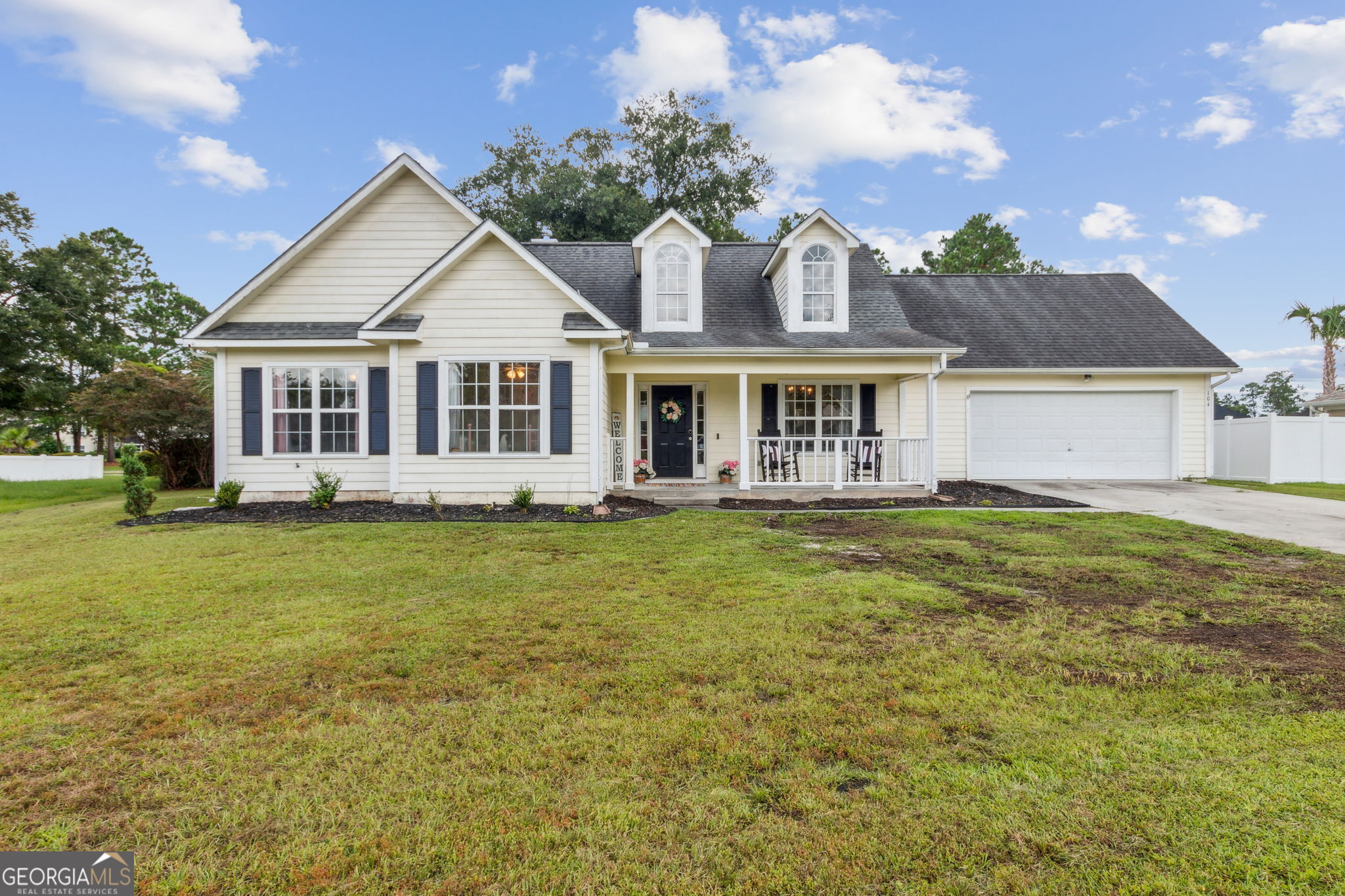 front view of a house with a small yard