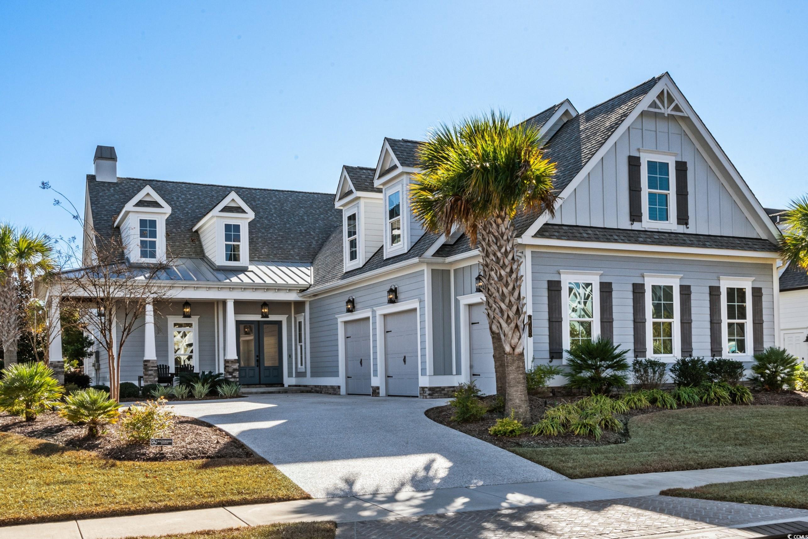 View of front of home featuring a garage