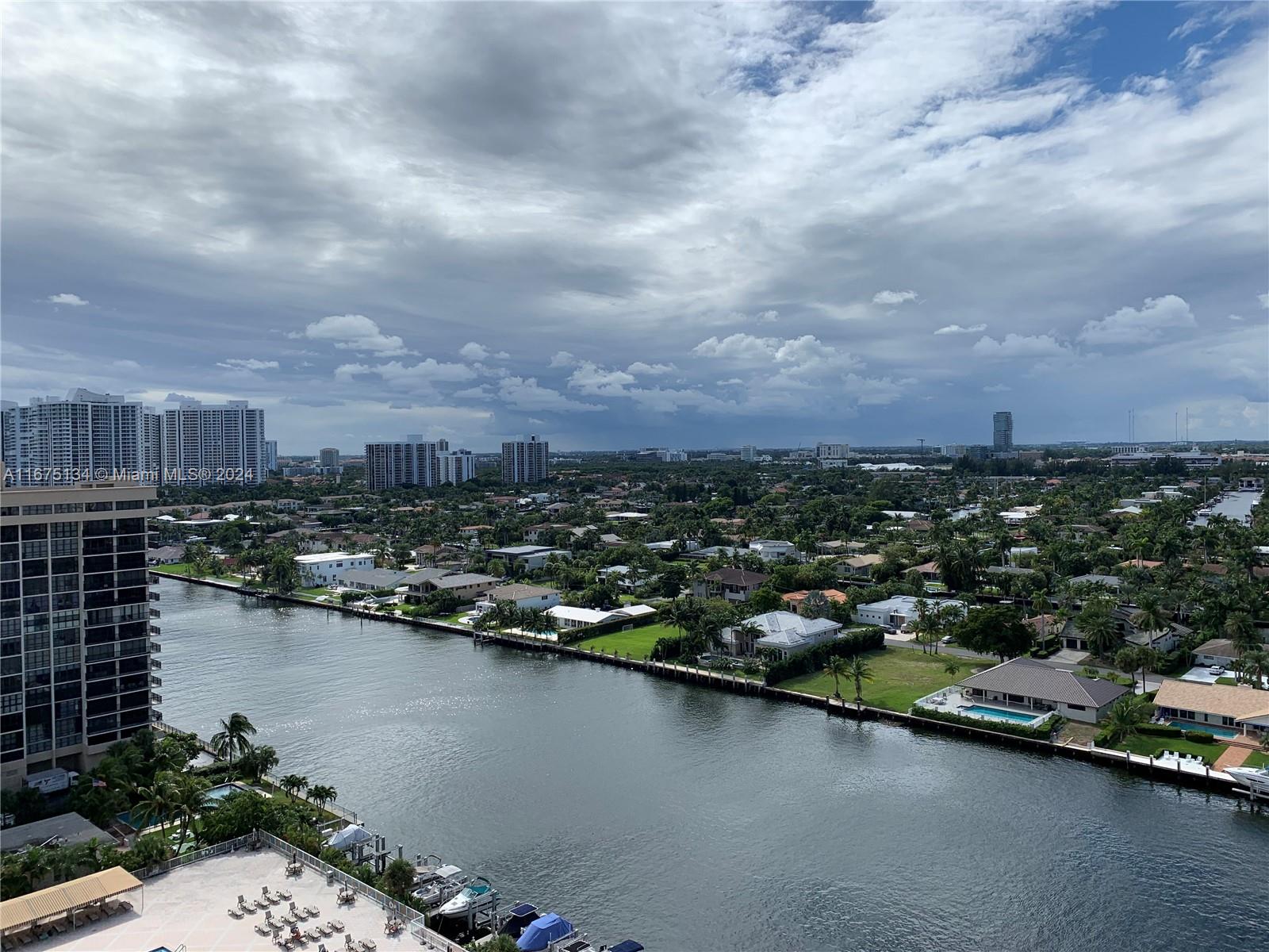 an aerial view of a city with lake view