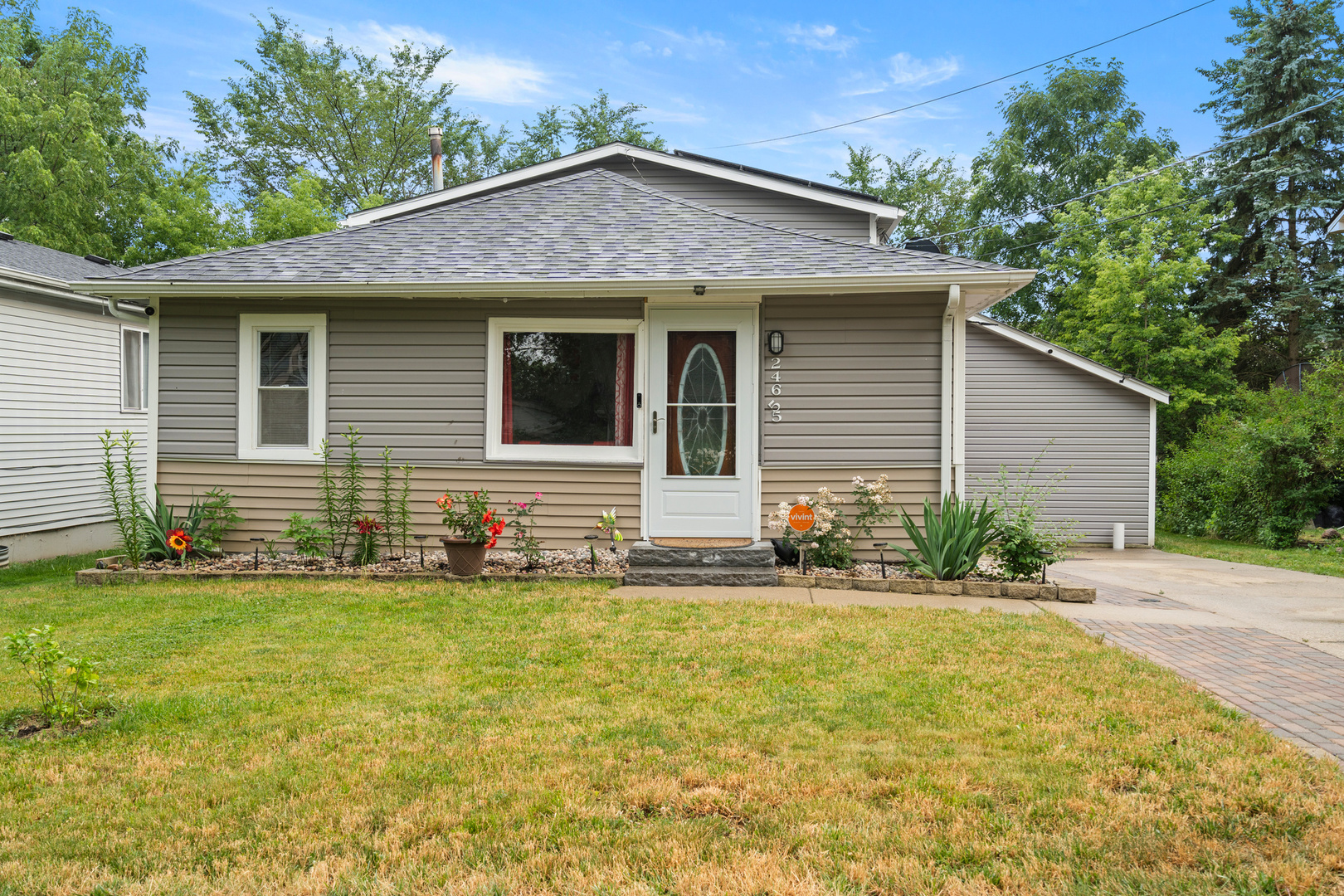 a front view of a house with a yard