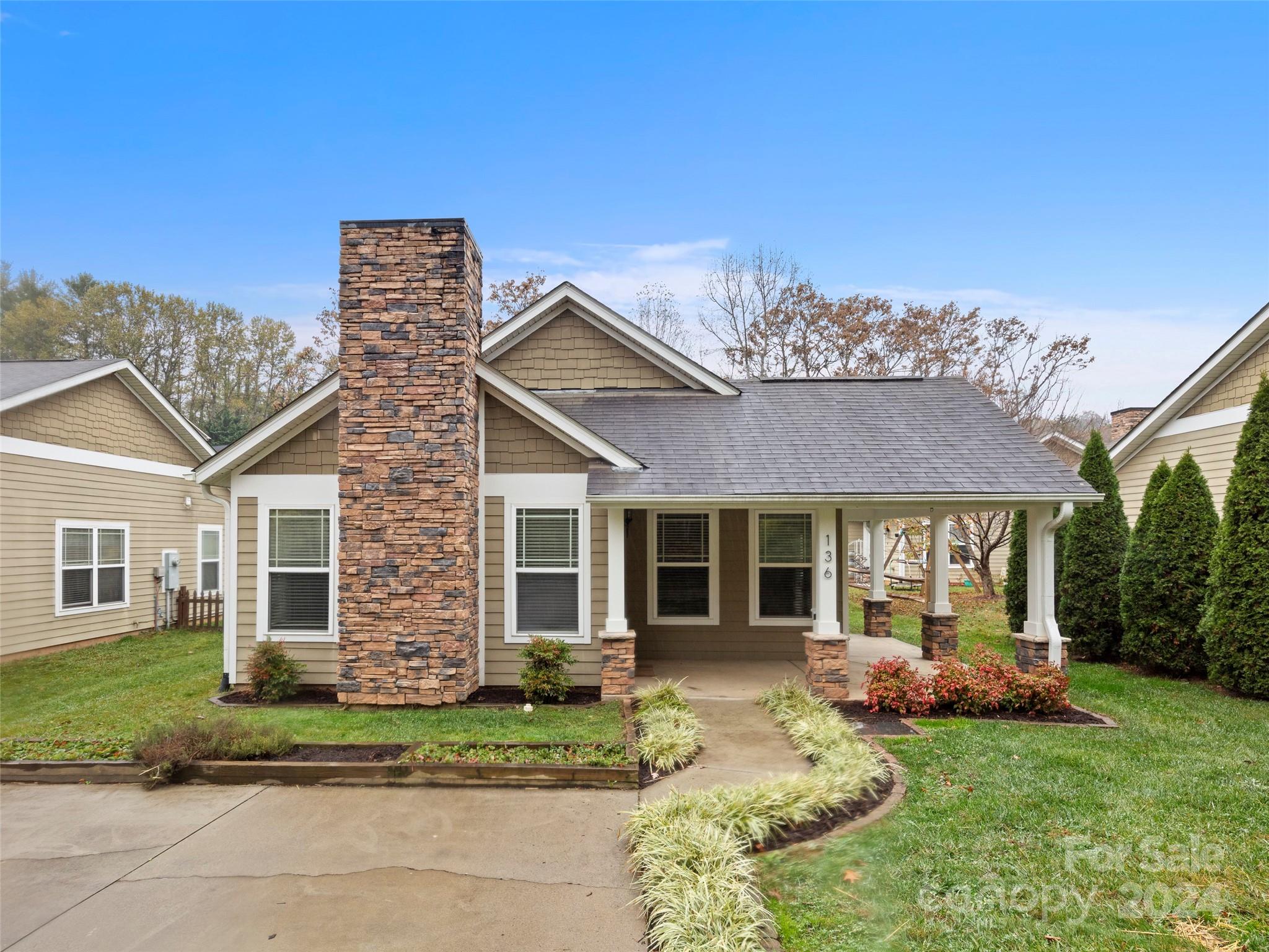 front view of a house with a yard