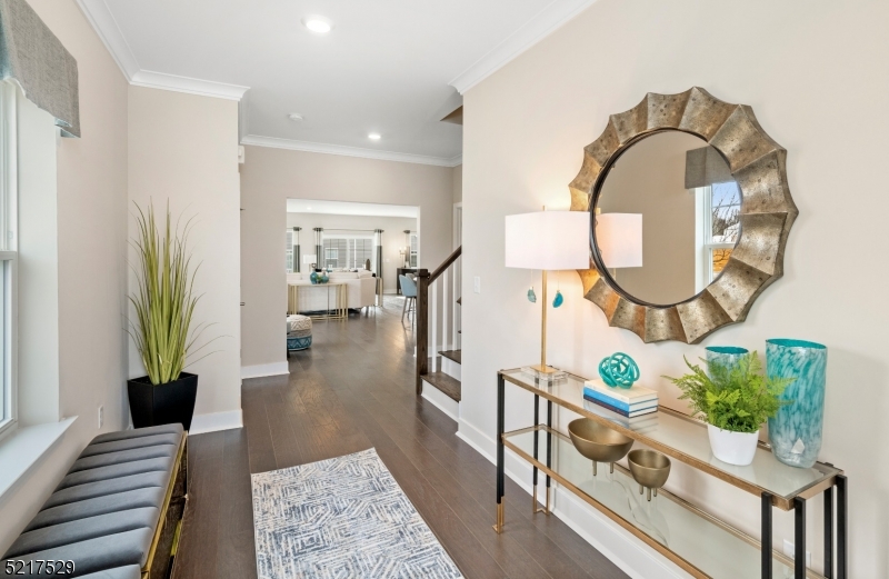 a living room with furniture and a mirror