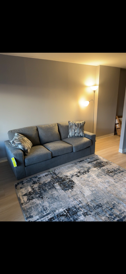 a living room with furniture and a couch