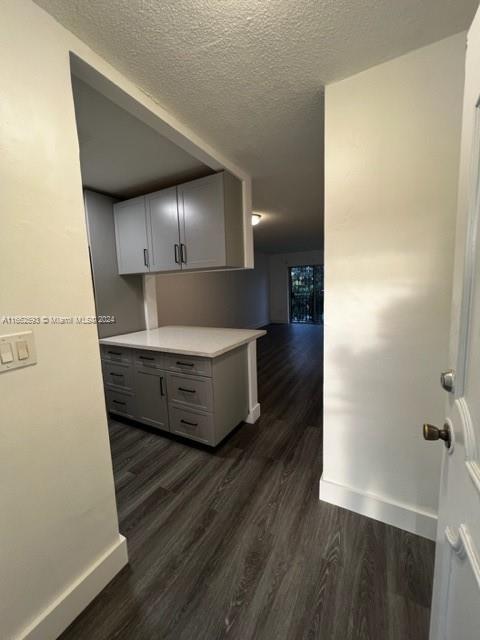 a view of a kitchen from the hallway