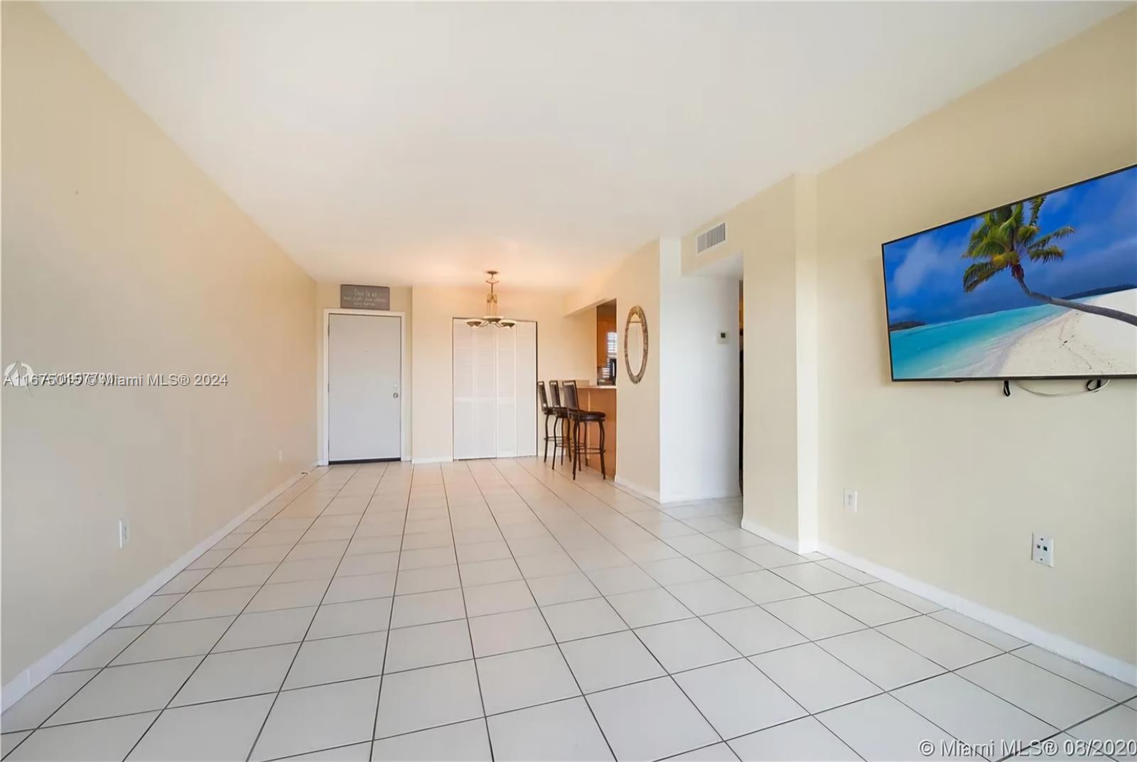 a view of a livingroom with an empty space and a sink