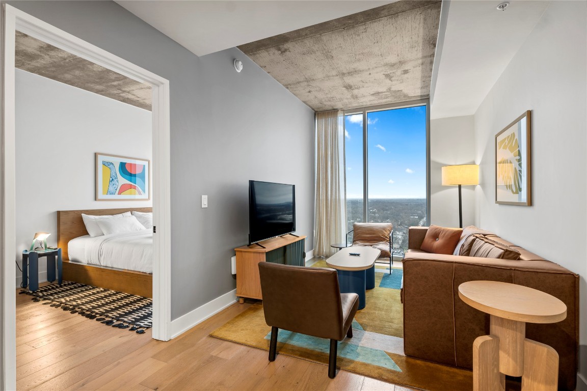 a living room with furniture and a flat screen tv