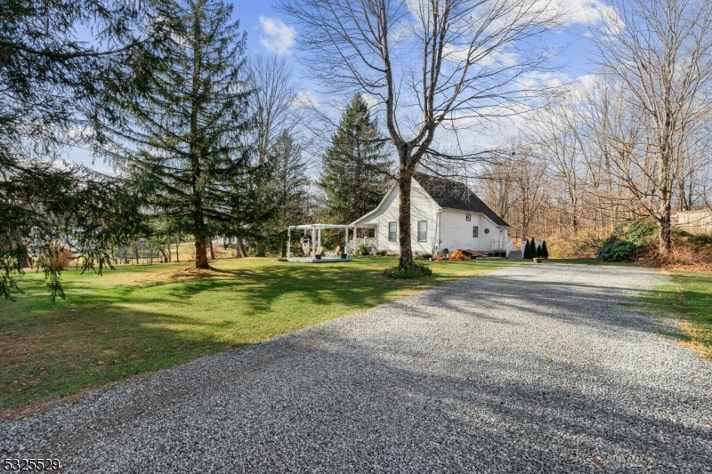 a view of a house with a big yard