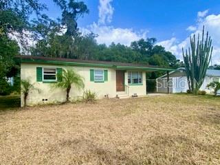 a house with trees in the background