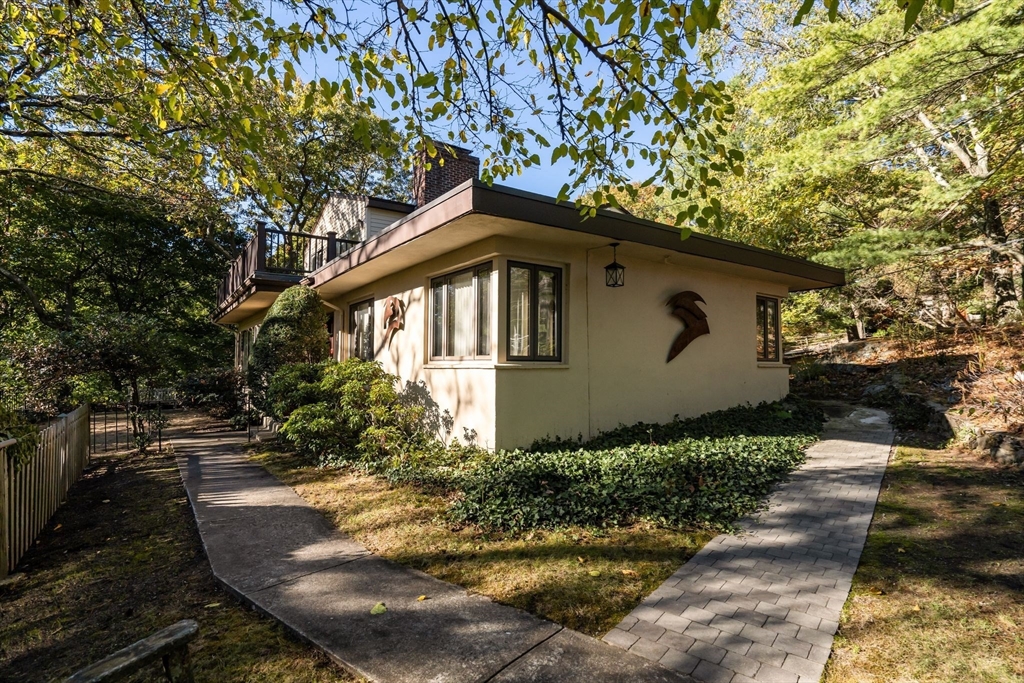 a front view of a house with garden