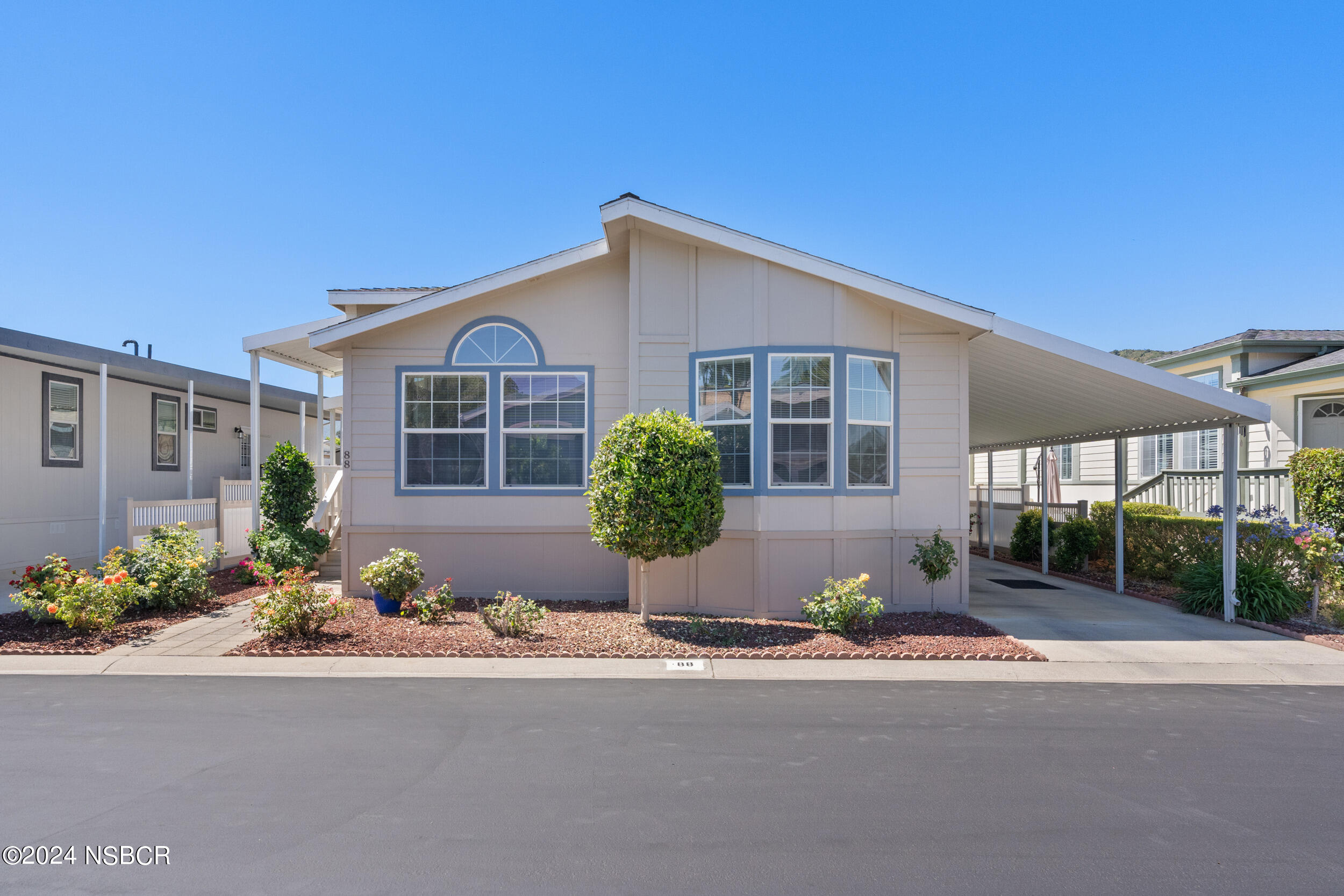 front view of a house with a yard