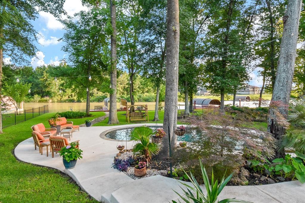 a view of a table and chairs in backyard of the house