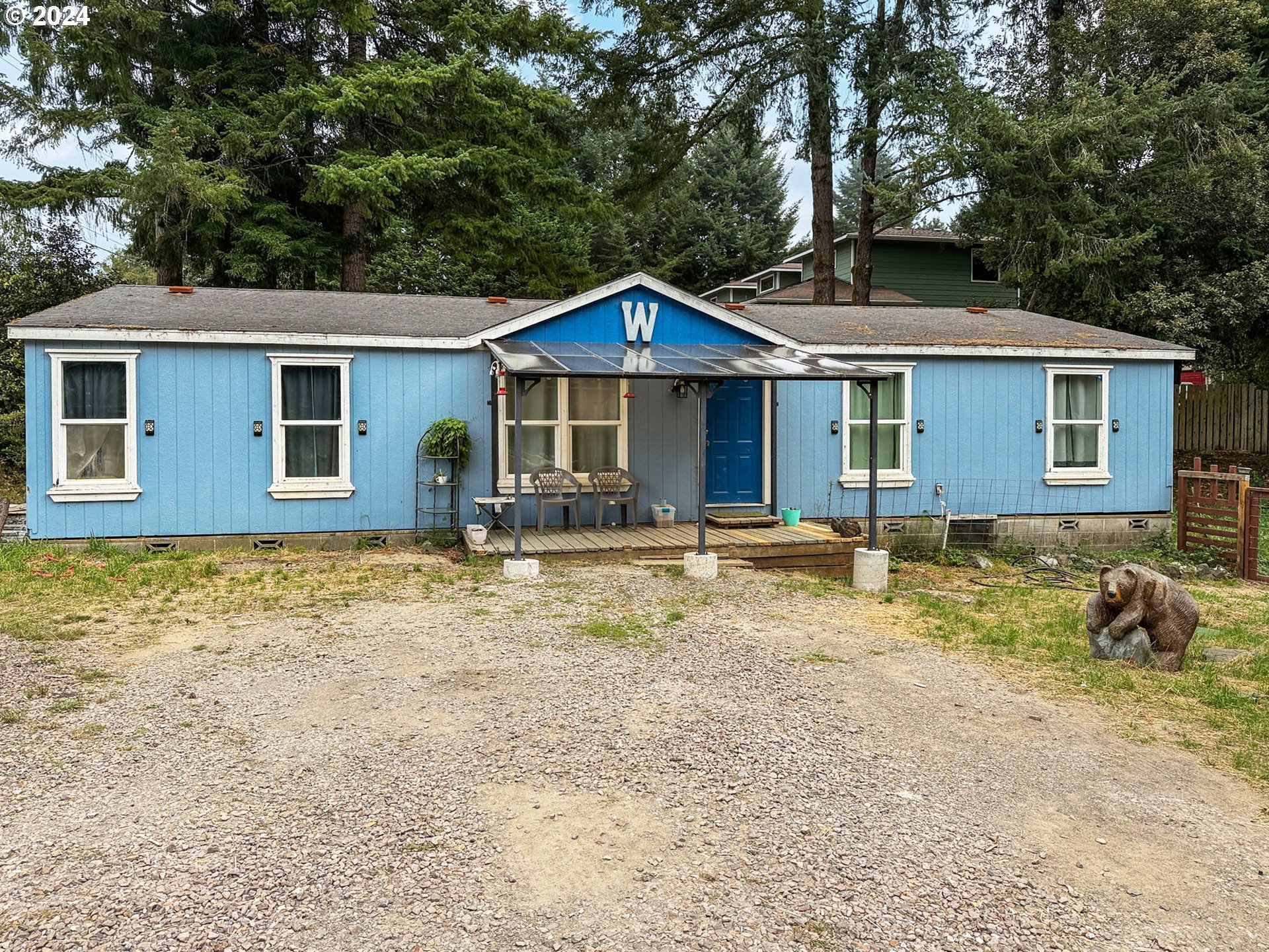 a front view of a house with garden