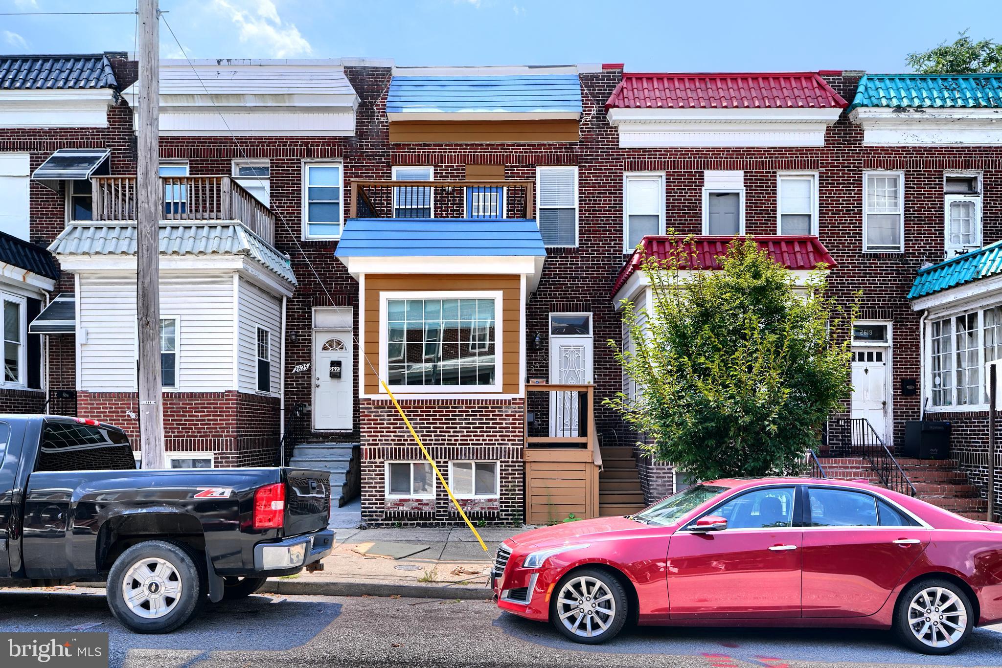 a front view of a house with parking space