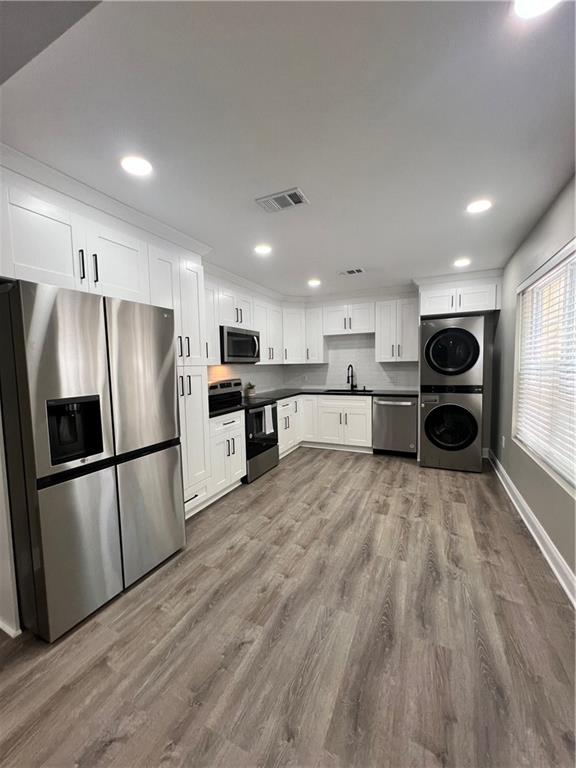 a large kitchen with stainless steel appliances