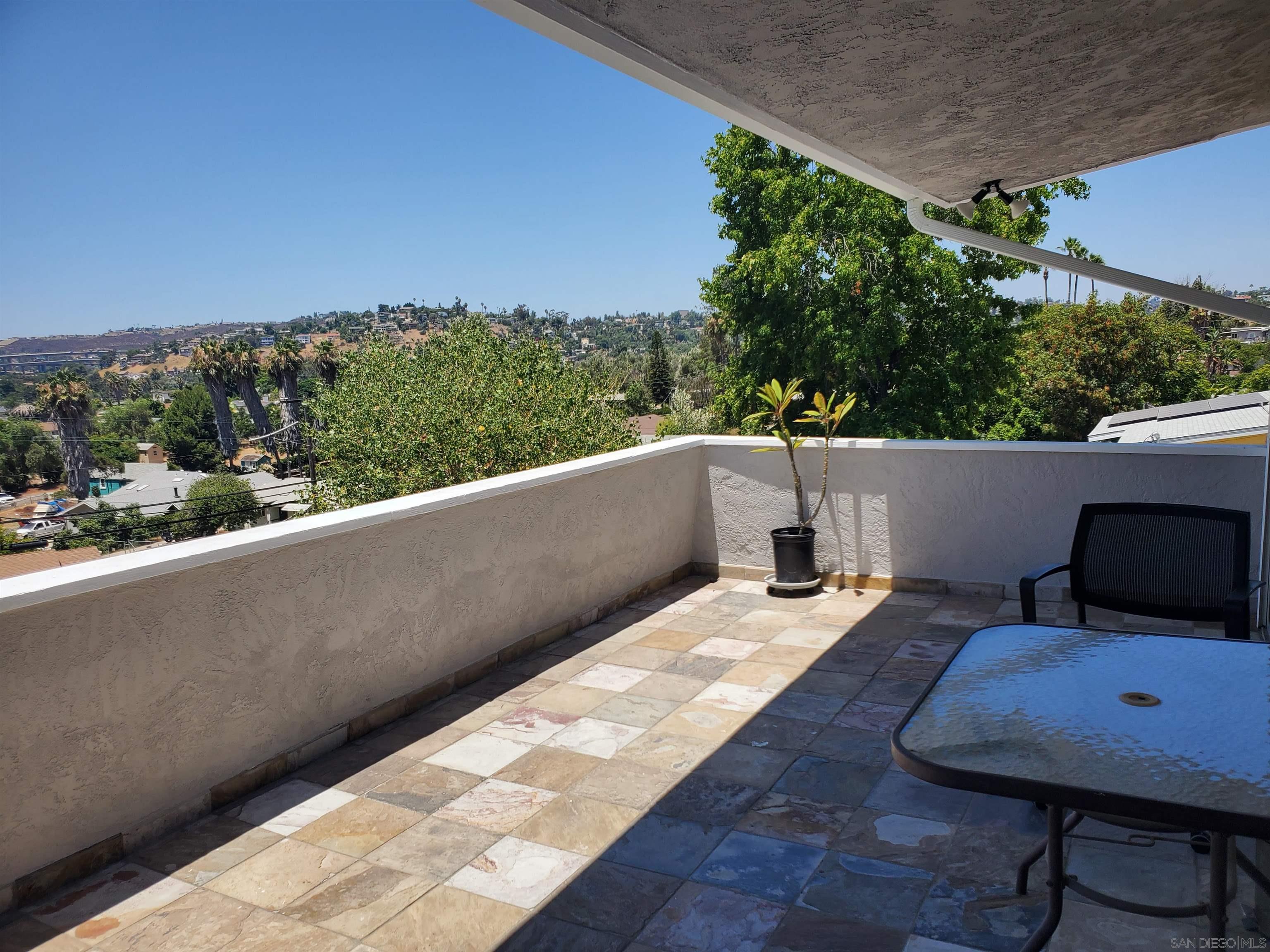 swimming pool view with a seating space