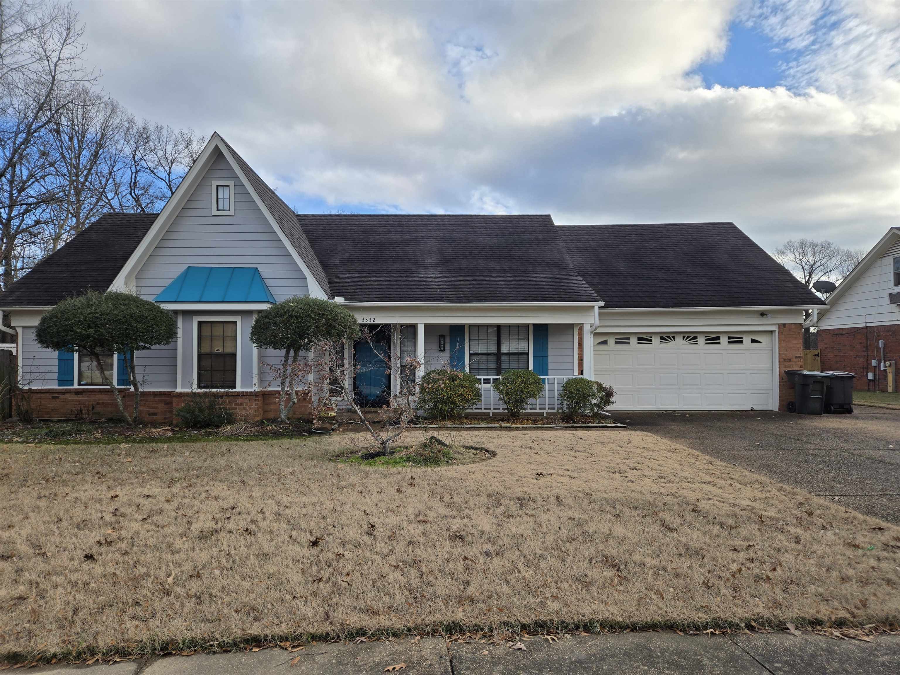 a front view of a house with garden