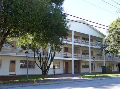 a view of a building with a garden