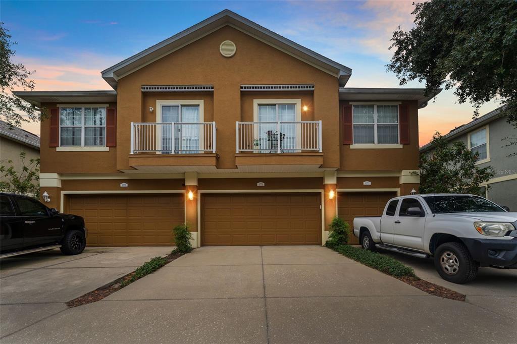 a front view of a house with parking