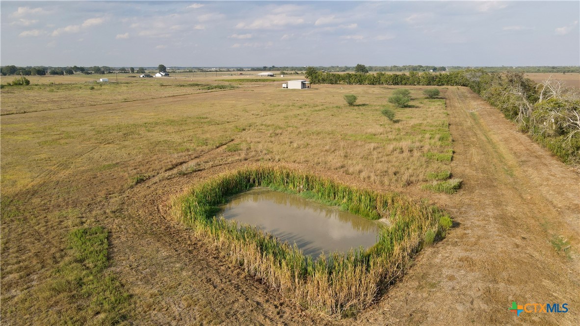 a view of a lake with a yard