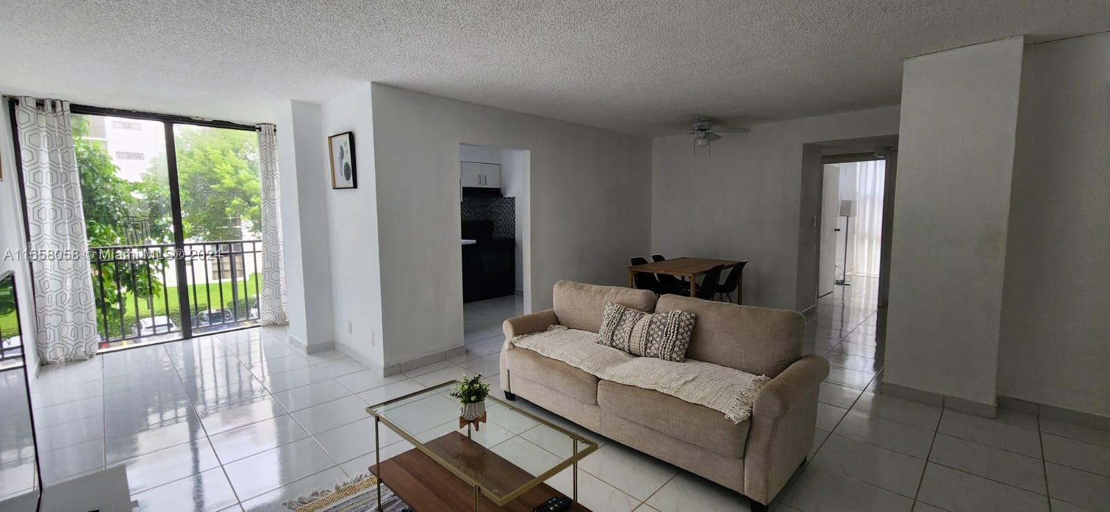 a living room with furniture and a window