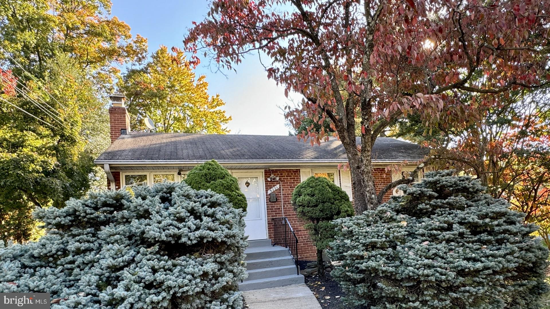 a front view of house with garden