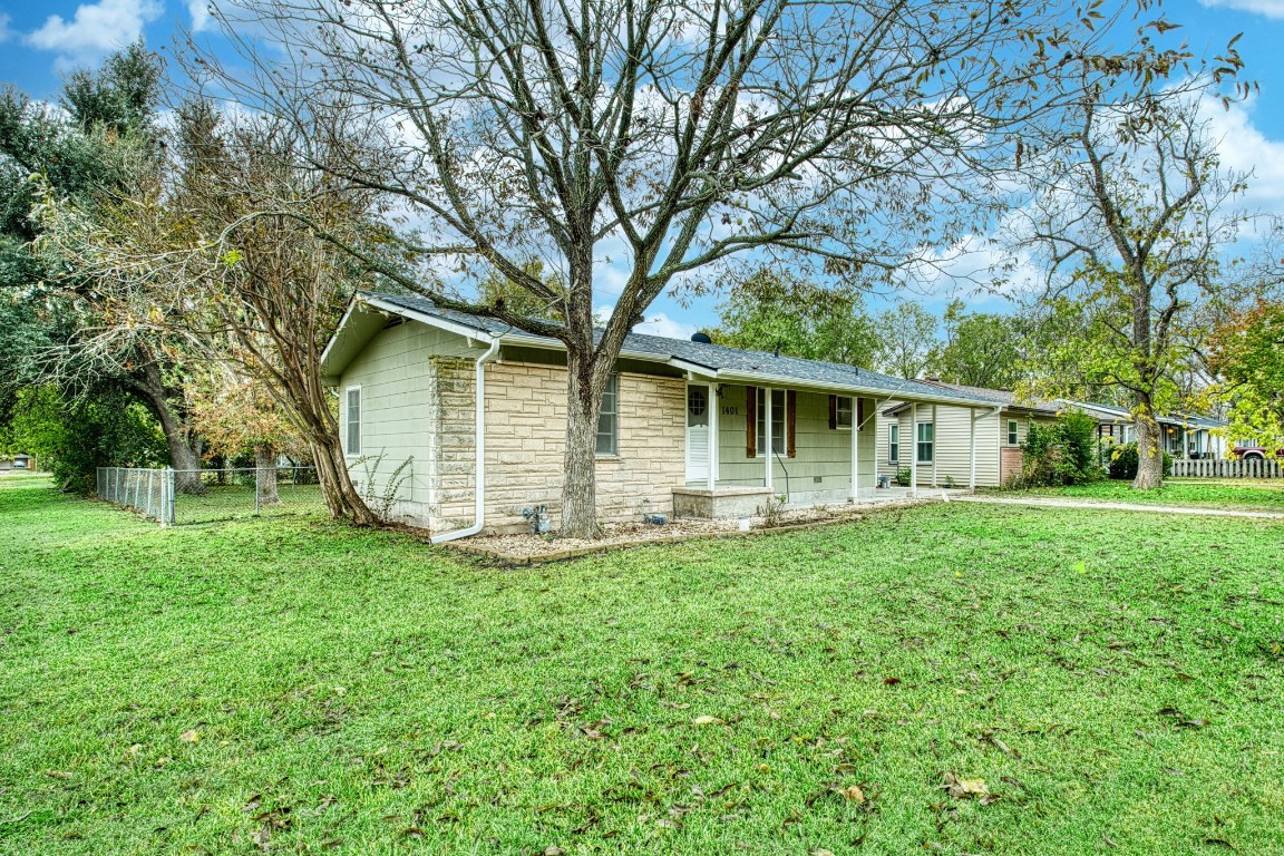 front view of a house with a yard