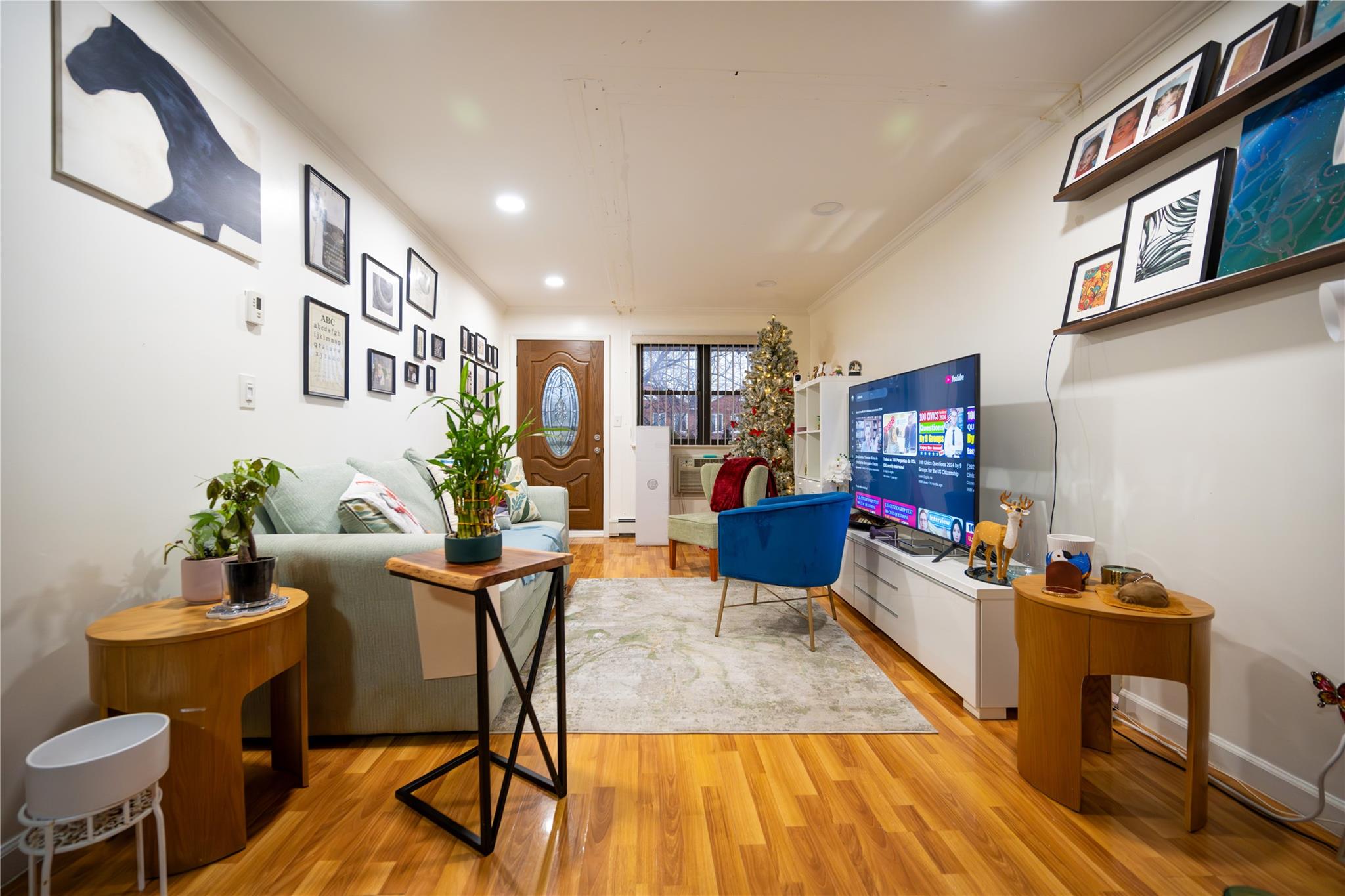 a living room with furniture and a potted plant