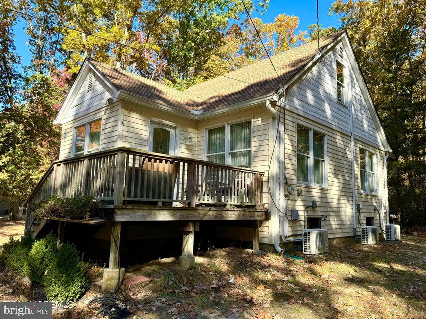 a view of a house with wooden deck