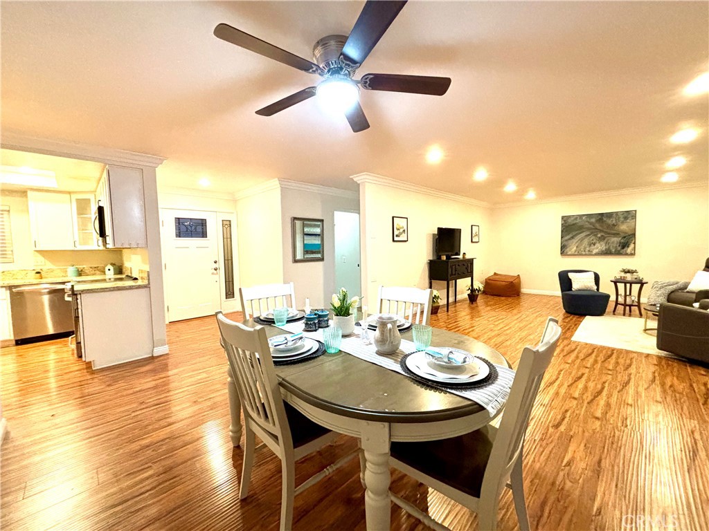 a view of a dining room with furniture and wooden floor