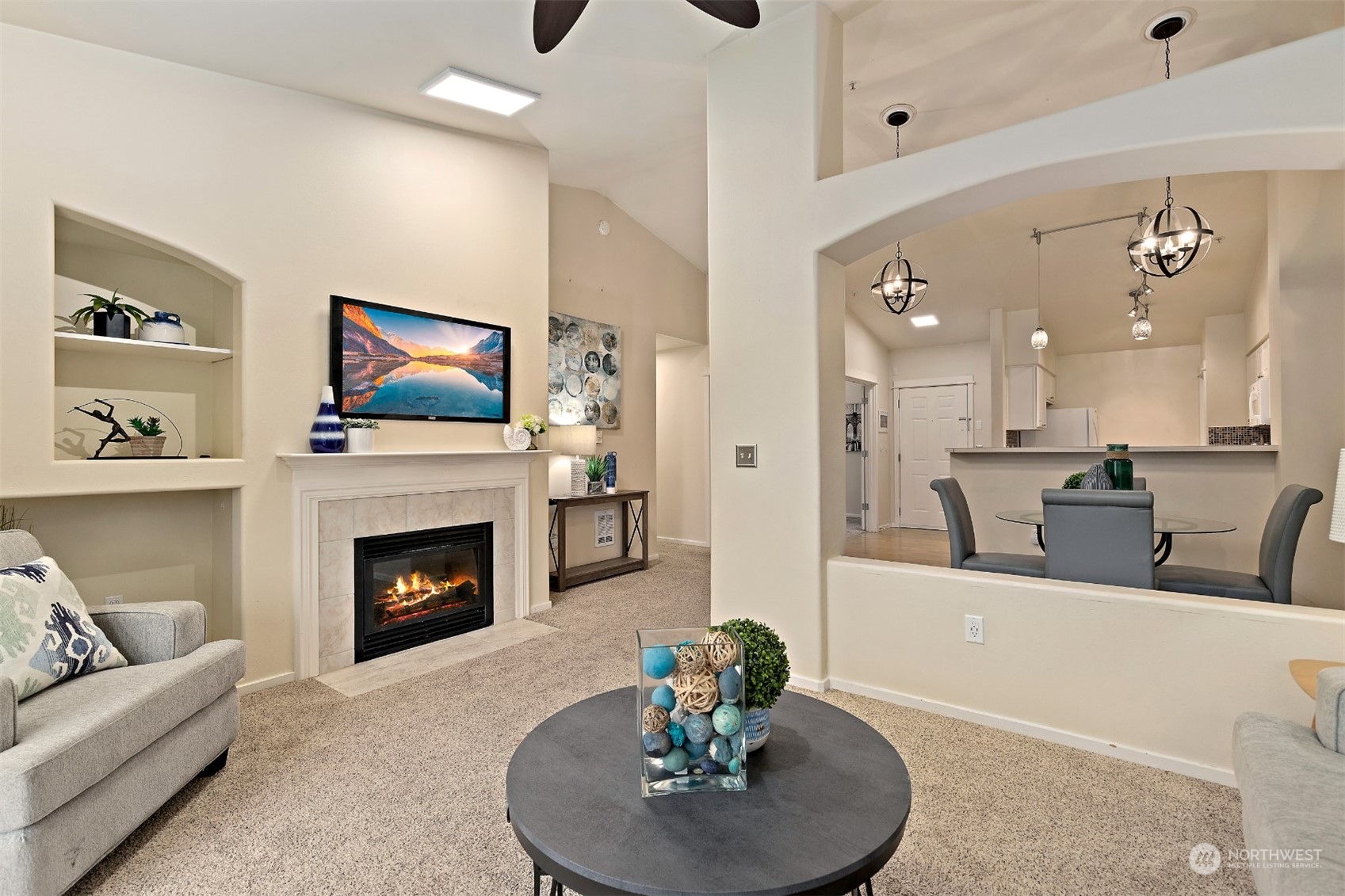 a living room with furniture and a fireplace