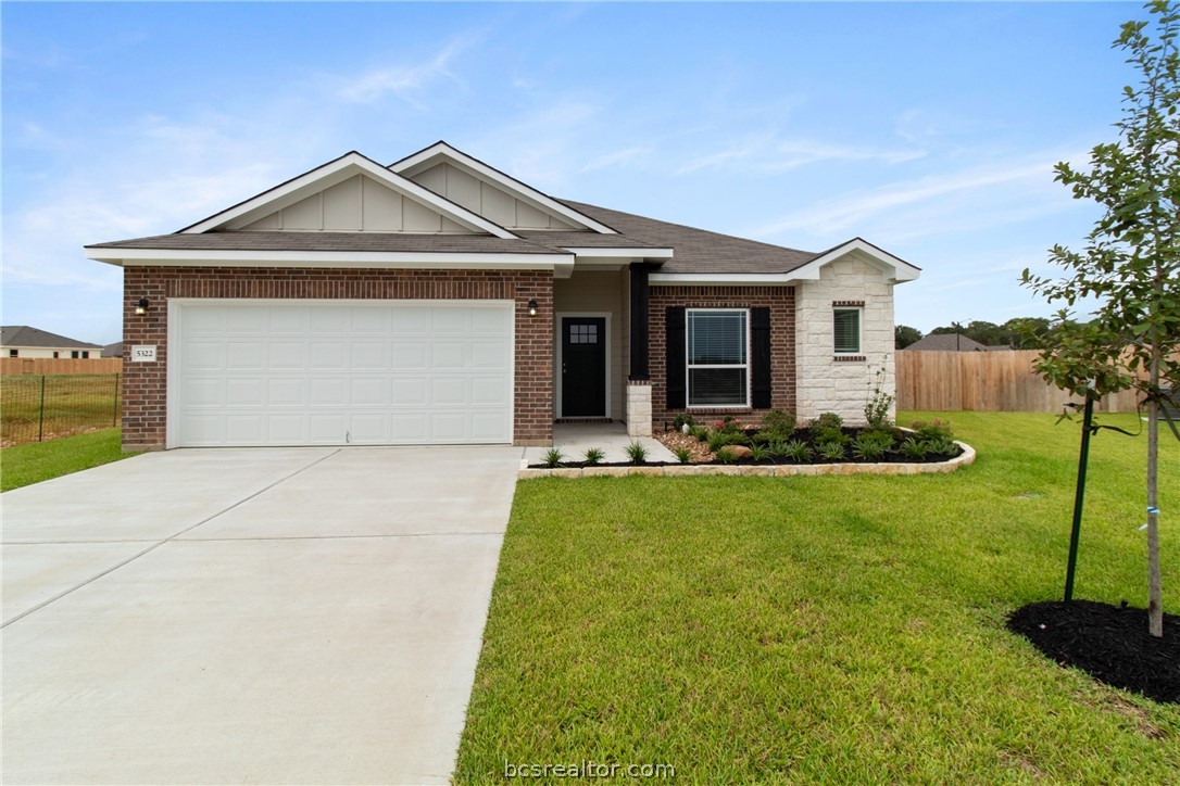 a front view of a house with yard