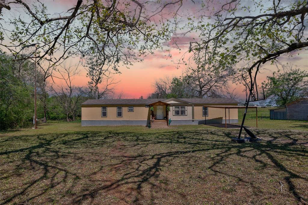 a house view with a backyard space