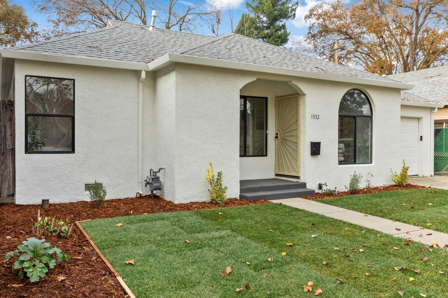 a front view of a house with a yard