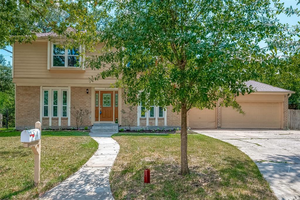 a house view with a garden space